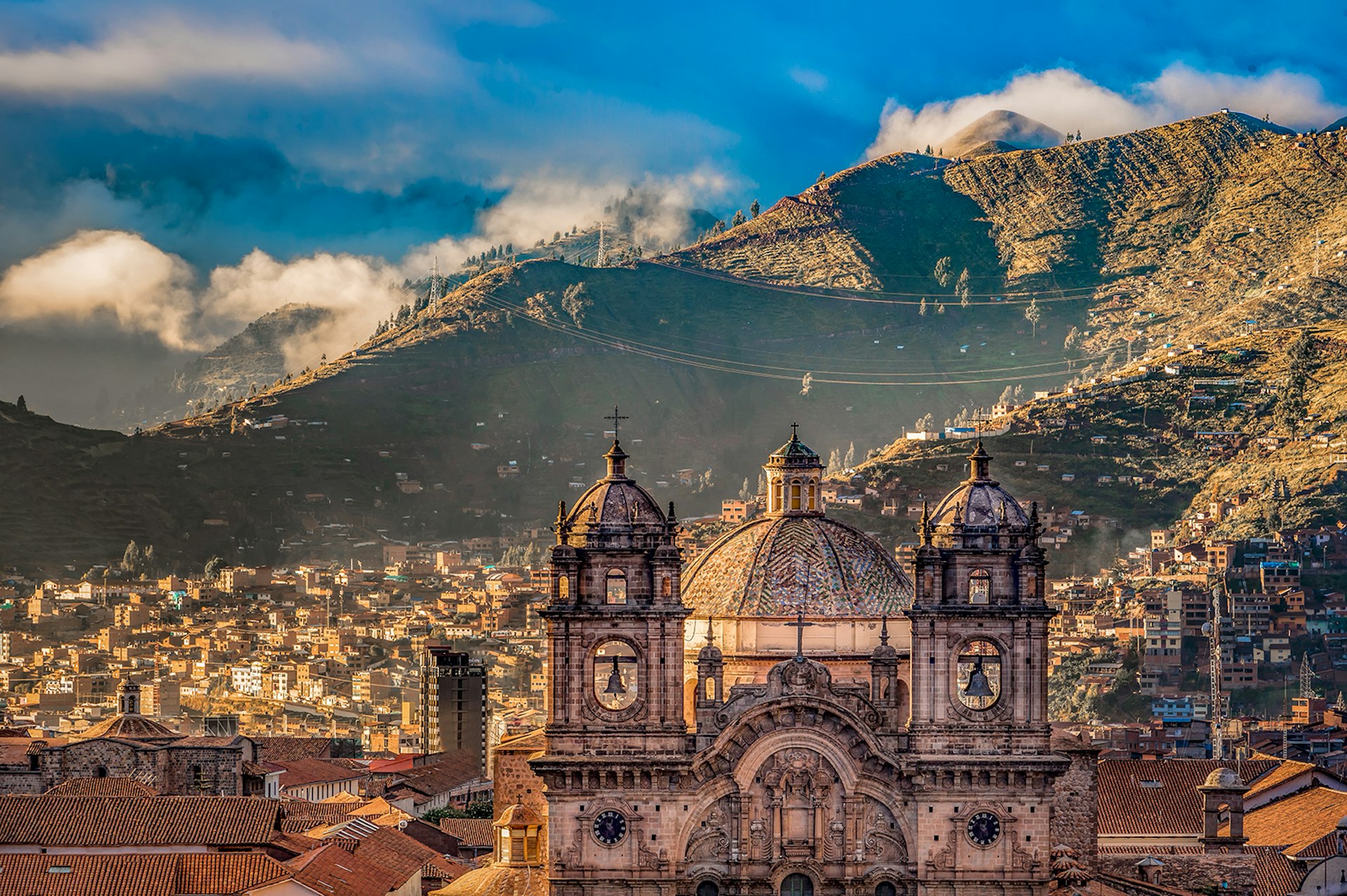 An aerial view of Cuzco with the cathedral bell towers in the foreground