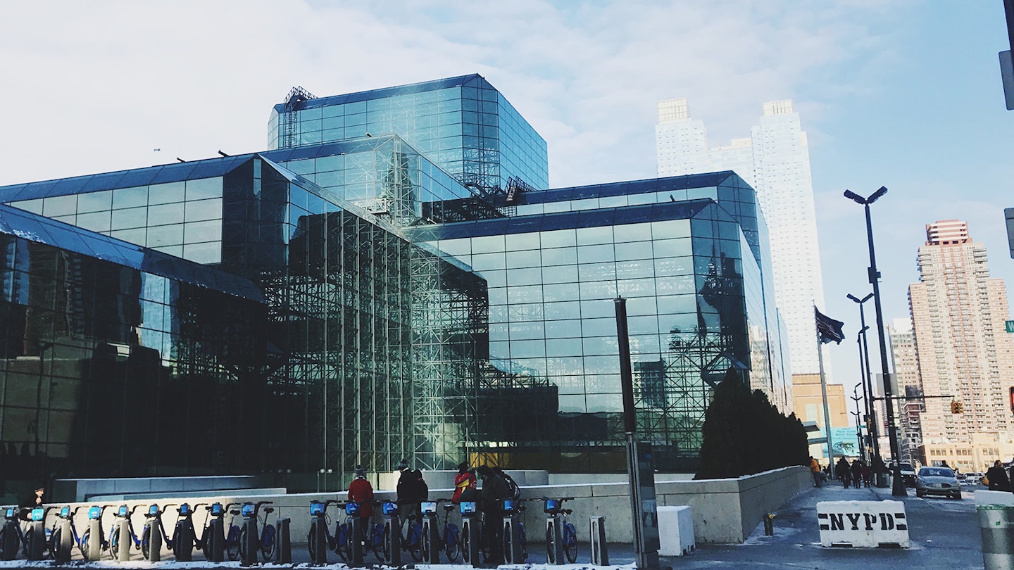 Citi Bike station just outside the glass facade of the Jacob Javits Center in New York City
