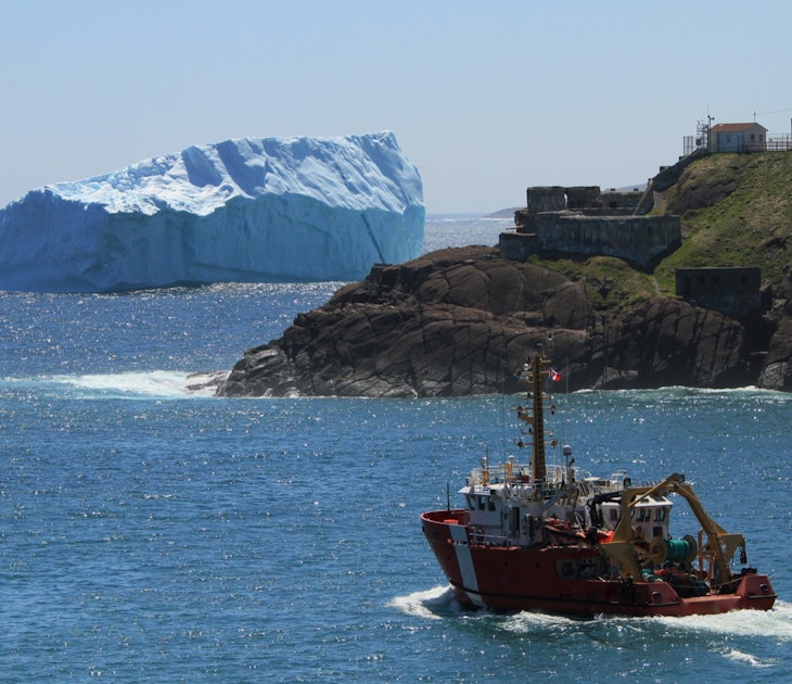 A huge iceberg floats in the harbor of St.John's , Newfoundland