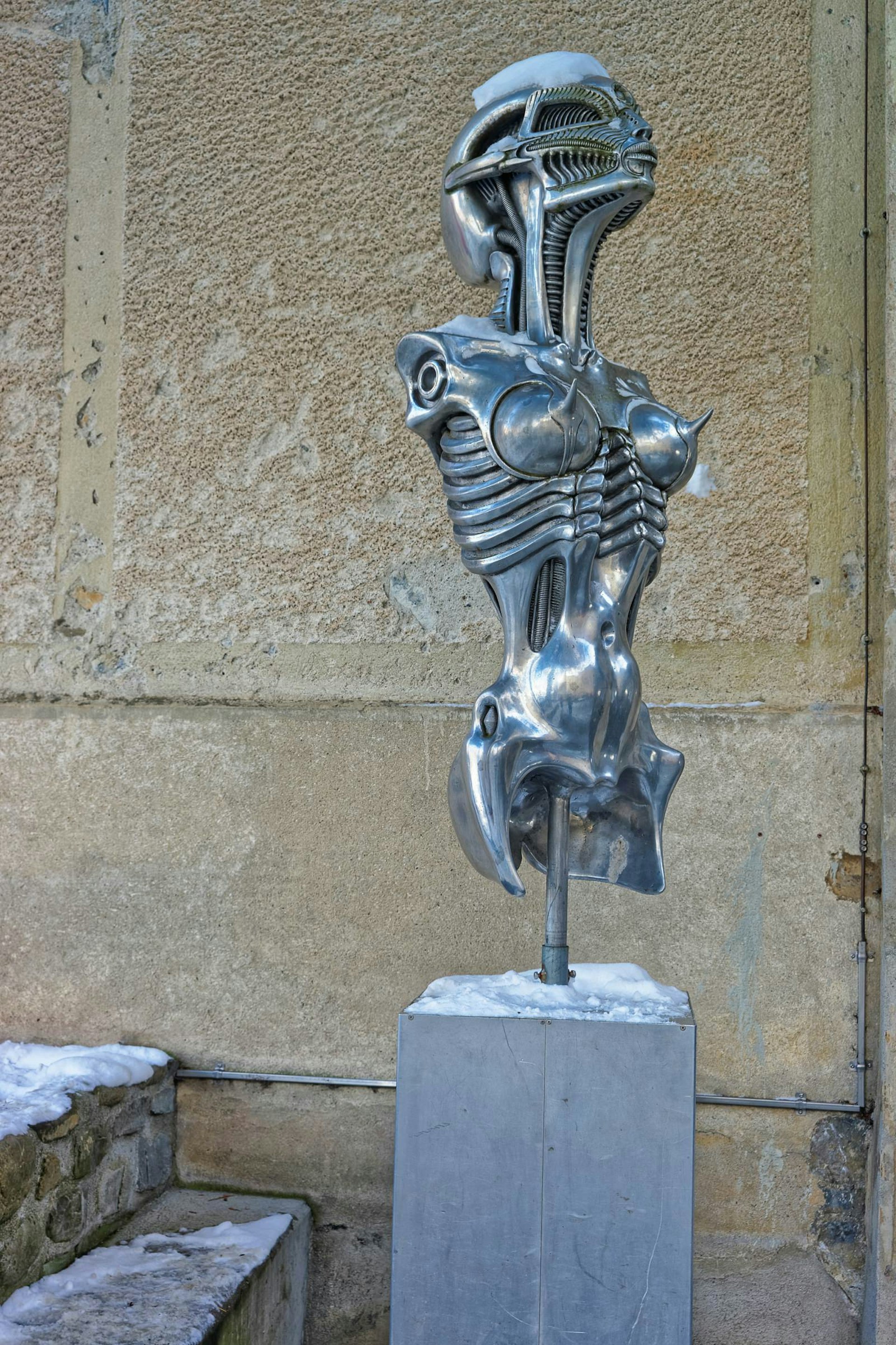 A statue of a metallic skeleton at the HR Giger Museum in Gruyères, Switzerland © Roman Babakin / Shutterstock