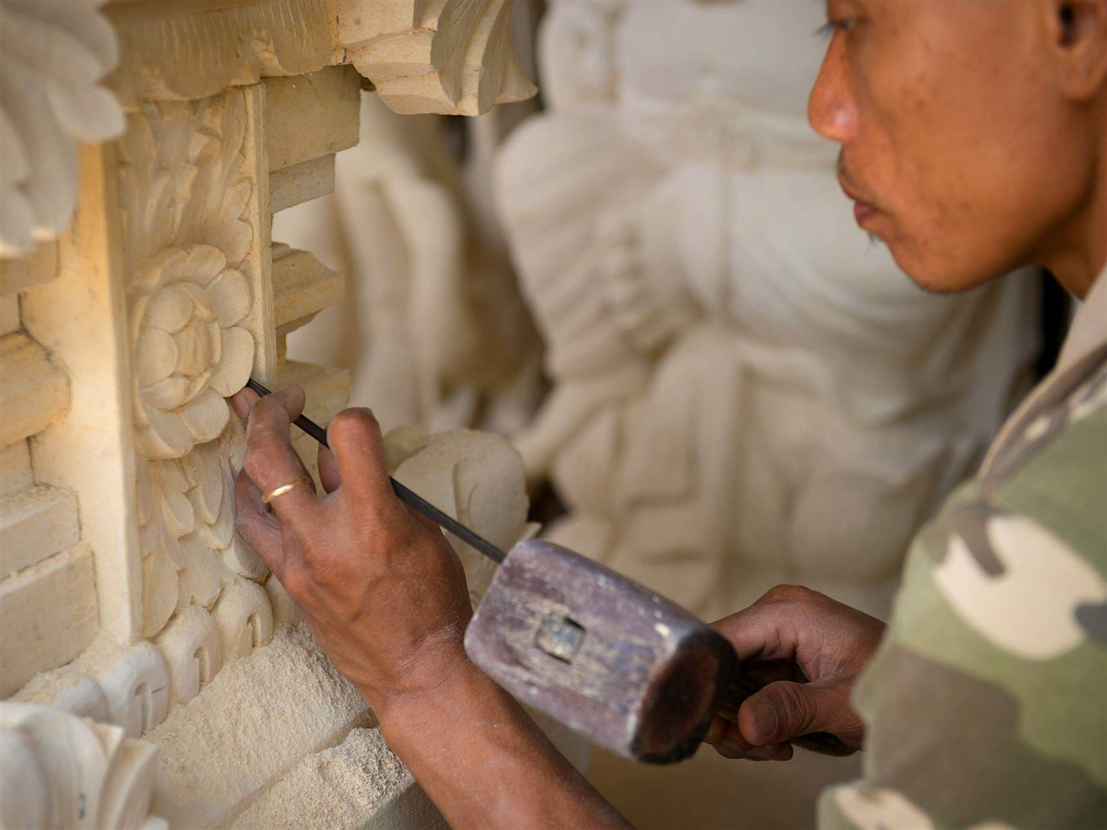 Features - stoneworker-batubulan-bali-74e6b3acf1d7 A stone carver works on a decorative motif © Iryna Rasko / Shutterstock