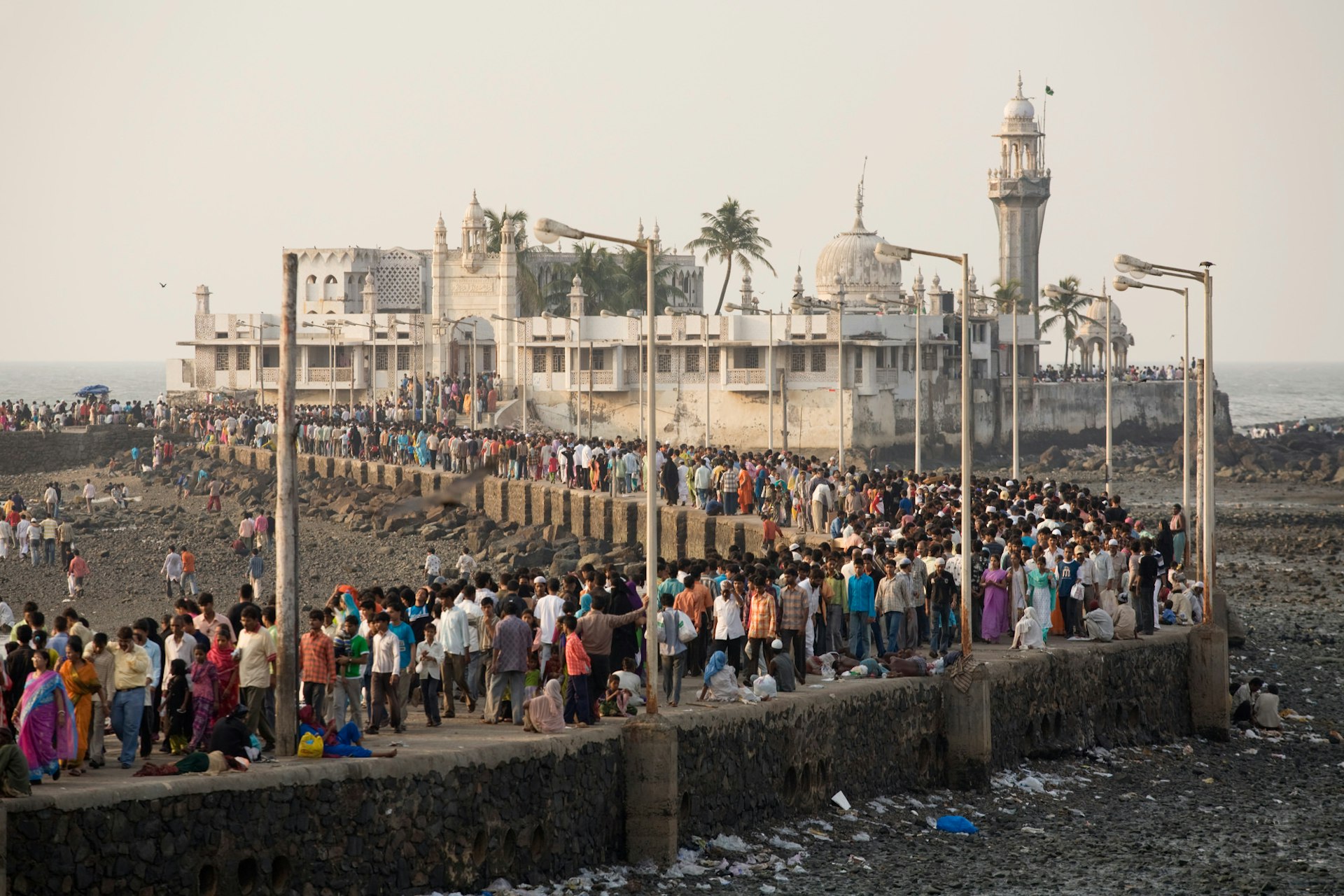 Pilgrims crowd the causeway leading to the tomb of Haji Ali © Orien Harvey / Getty Images