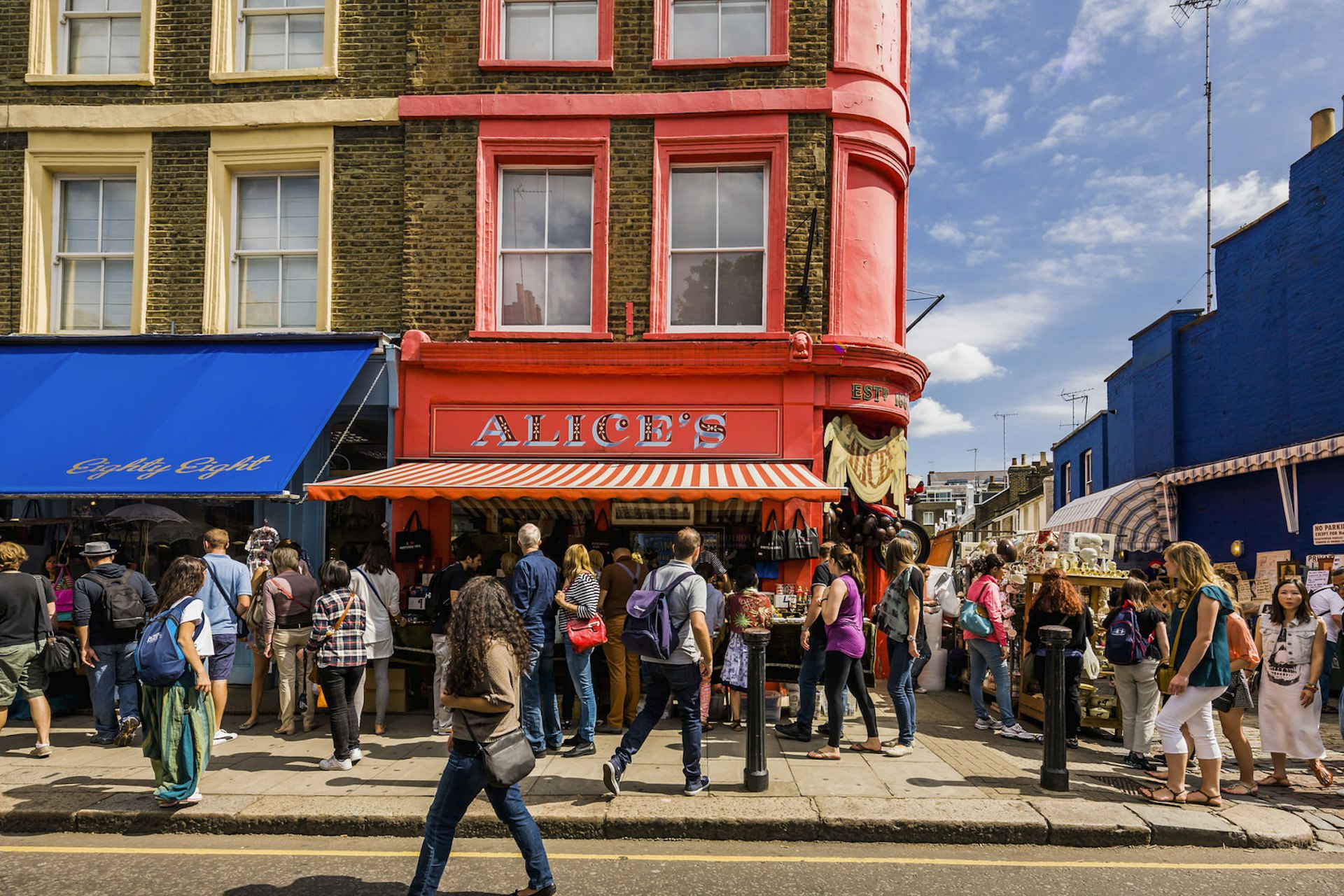People walking in the street in Notting Hill's Portobello Road Market