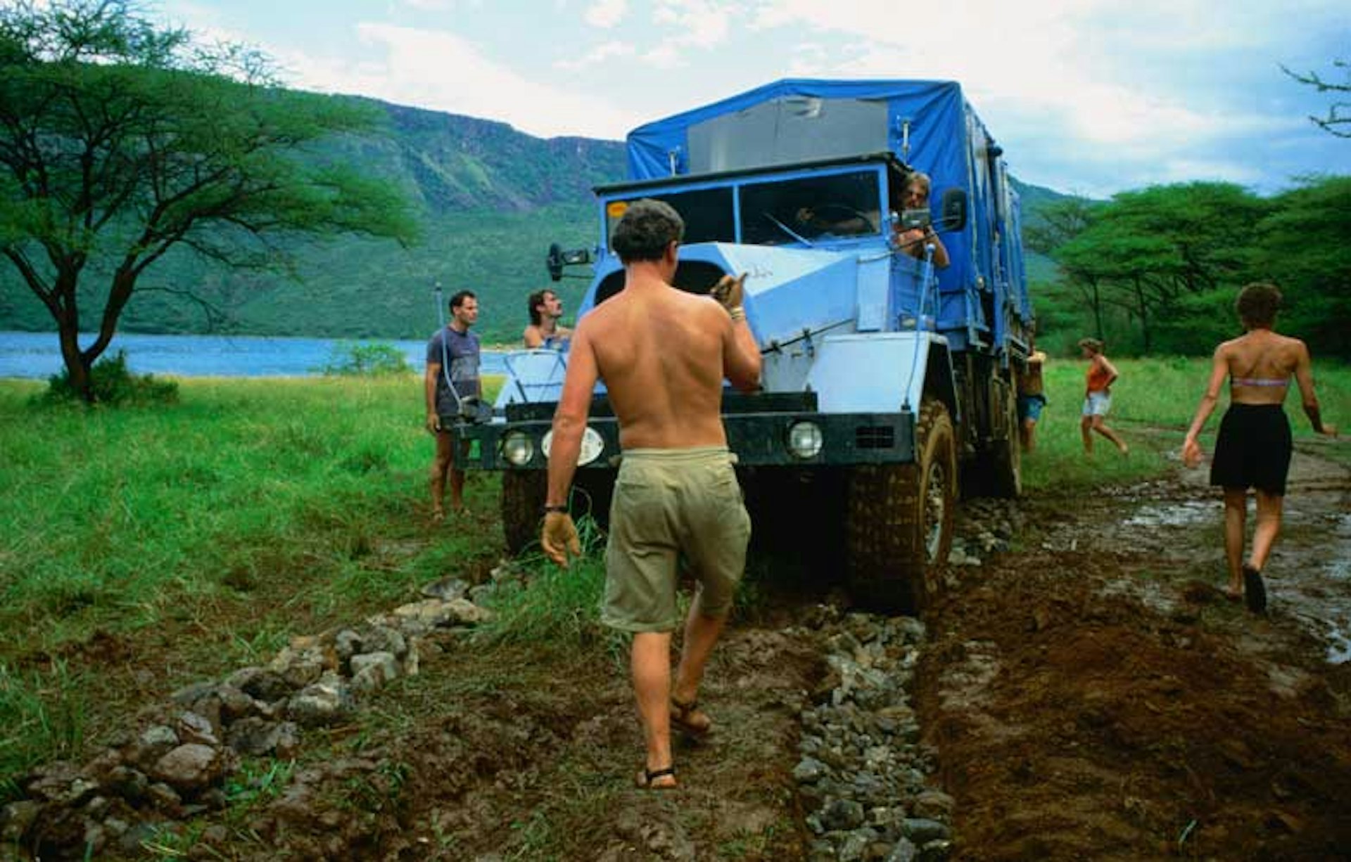 Overland truck stuck in the mud, Kenya. Image by Christer Fredriksson / Lonely Planet Images / Getty Images
