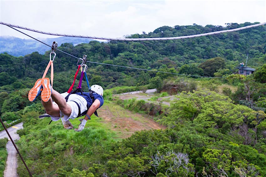 Features - shutterstockRF_486942373-d3cc8d5a1480 A man is suspended horizontally above forest