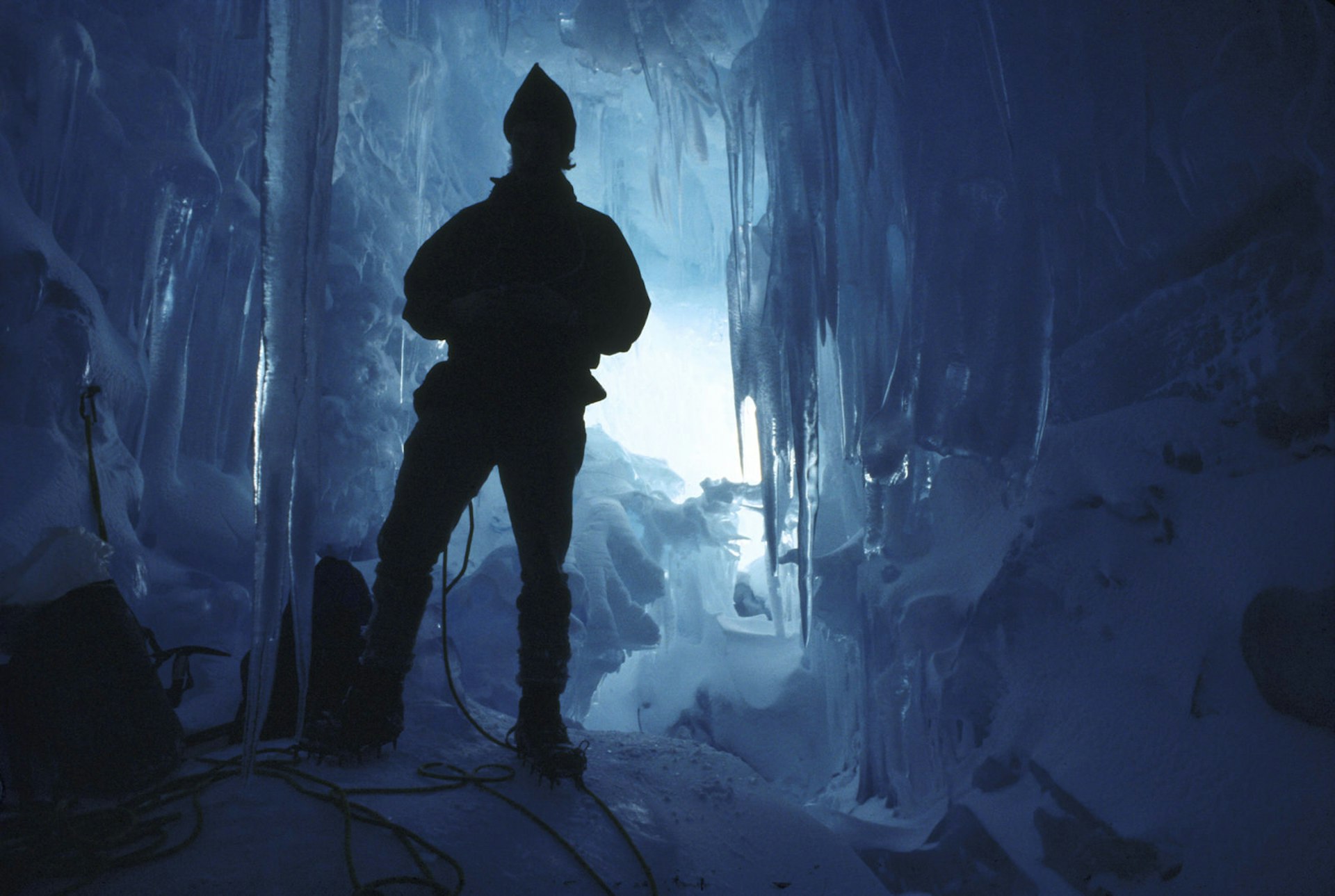 Silhouette of man in an ice cave