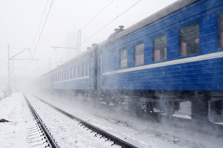 A train travelling through the snow in Siberia © Fursov Aleksey / Getty Images