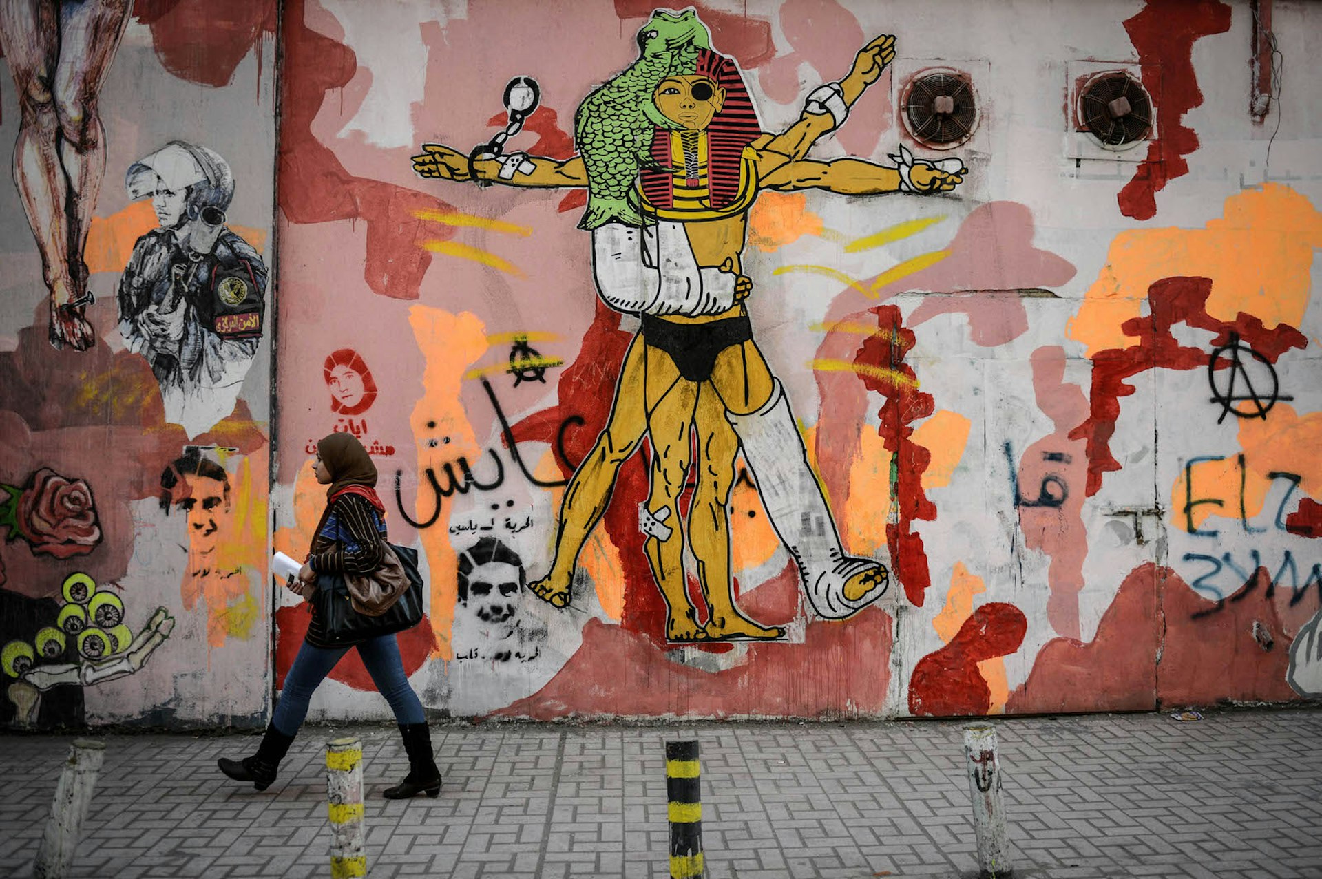 The subject matter of graffiti near Tahrir Sq reflects the city's turbulent recent history. Image by Mohamed Hossam / Anadolu Agency / Getty Images