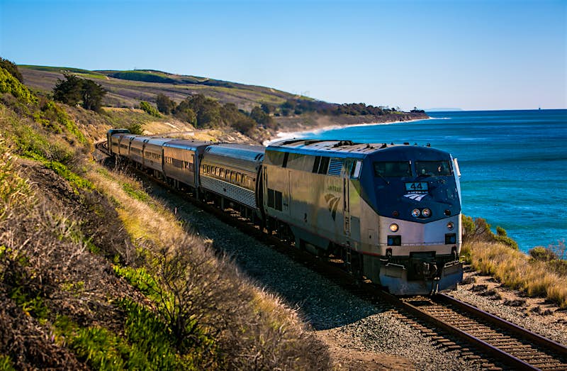 Features - Exploring Santa Barbara's Coastal Charms An Amtrak Surfrider train runs along the coast near El Capitan State Beach