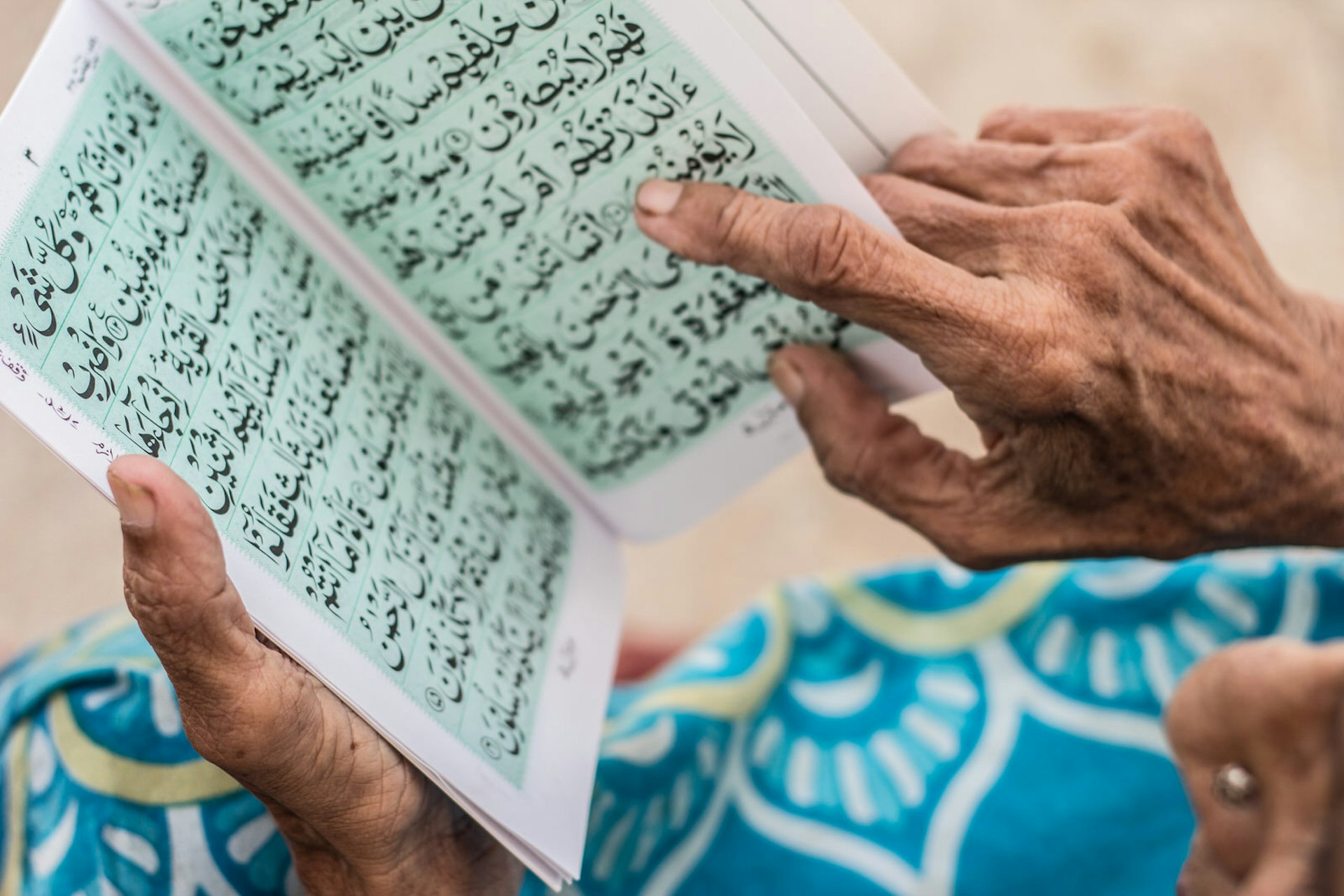 Reading the Islamic holy book. Image by Aliraza Khatri's Photography / Getty