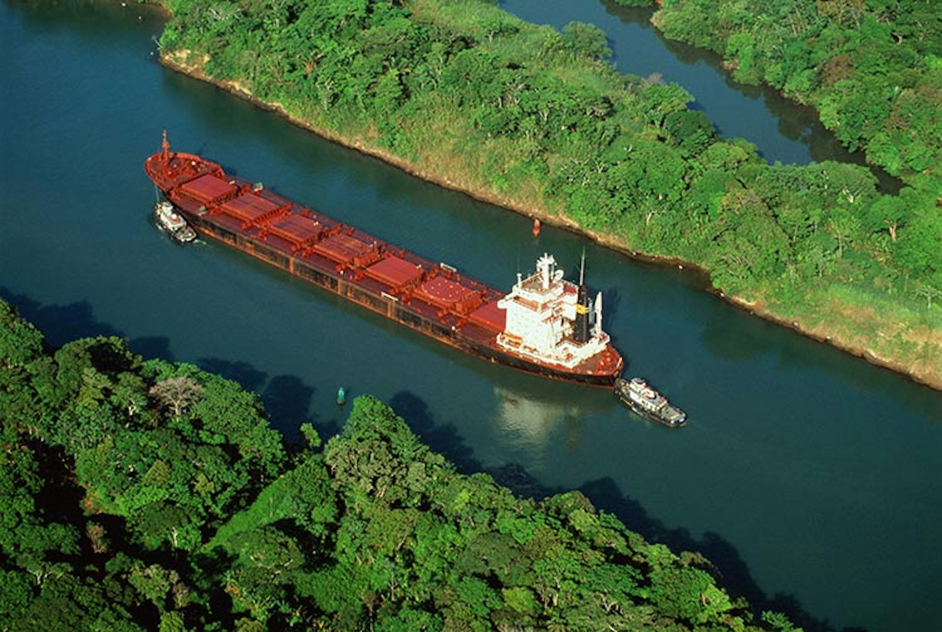 No need to stow away among the barrels, you can legitimately see the Panama Canal by cargo freighter. Image by Will & Deni McIntyre / The Image Bank / Getty Images