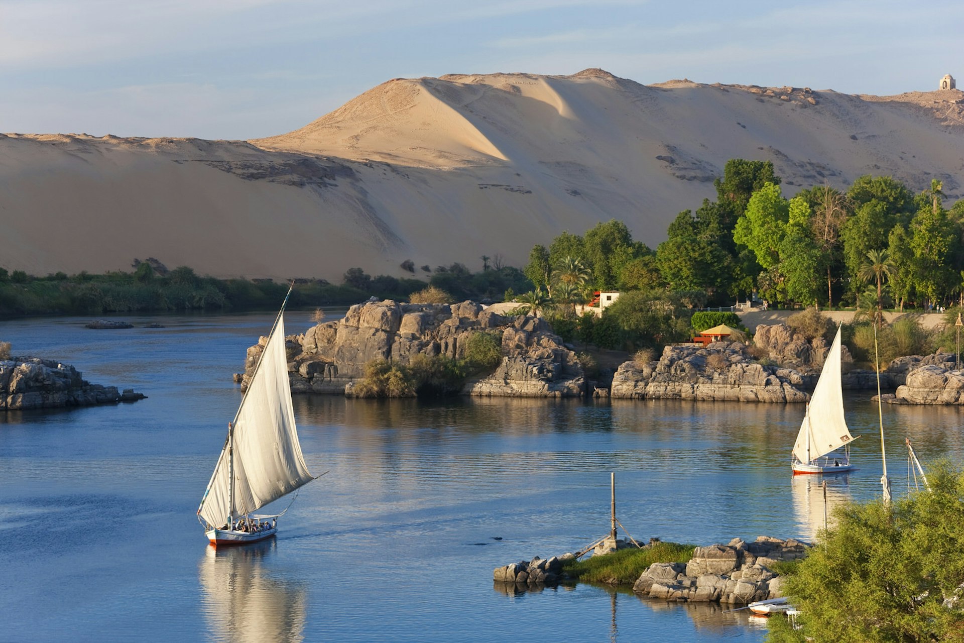 Felucca sailboats on River Nile, Aswan, Egypt. Image by Peter Adams / Getty Images