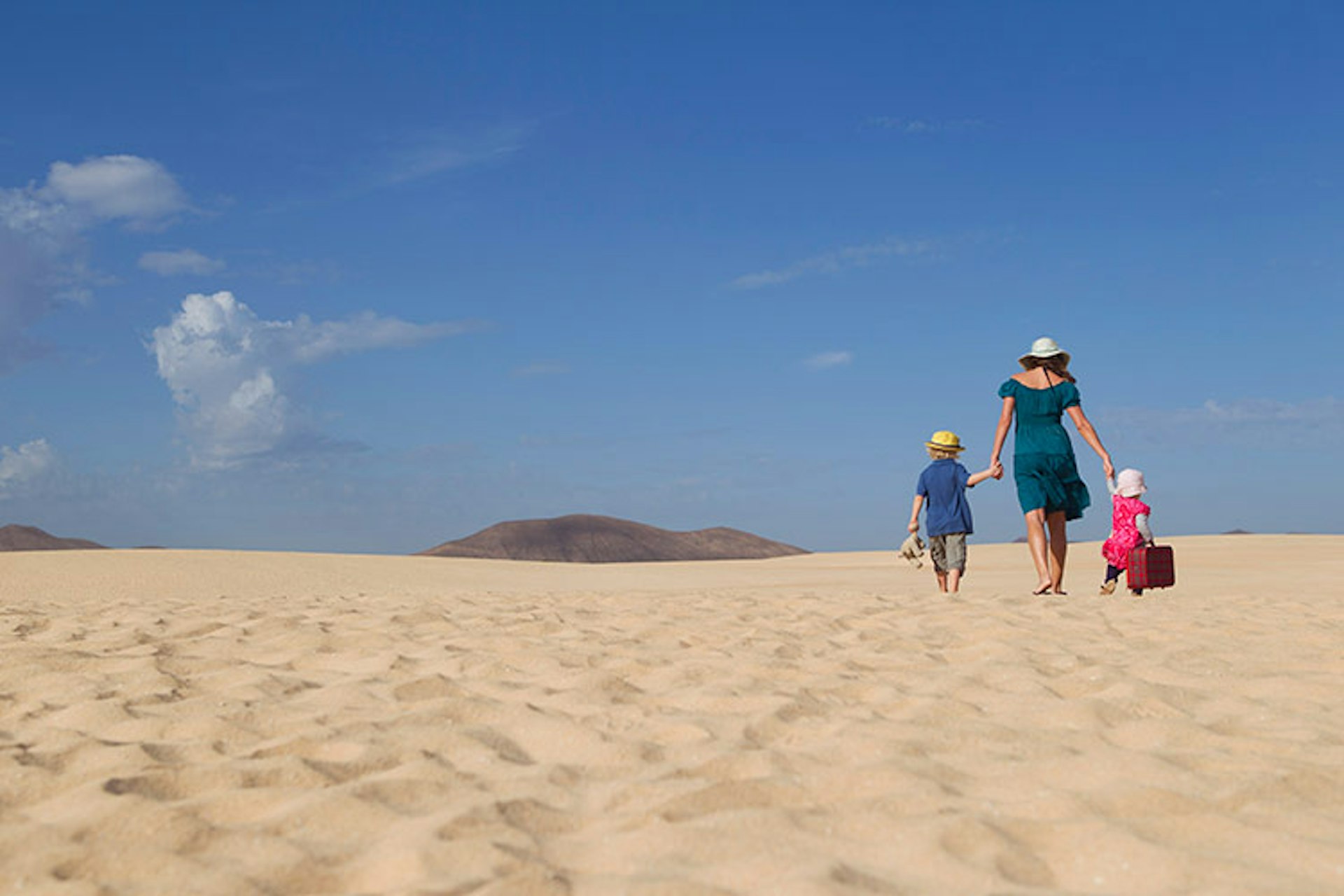 'You packed it, you can haul it over these dunes yourself.' The art of packing lightly is a valuable learning point for young travellers. Image by jackSTAR / Cultura / Getty Images