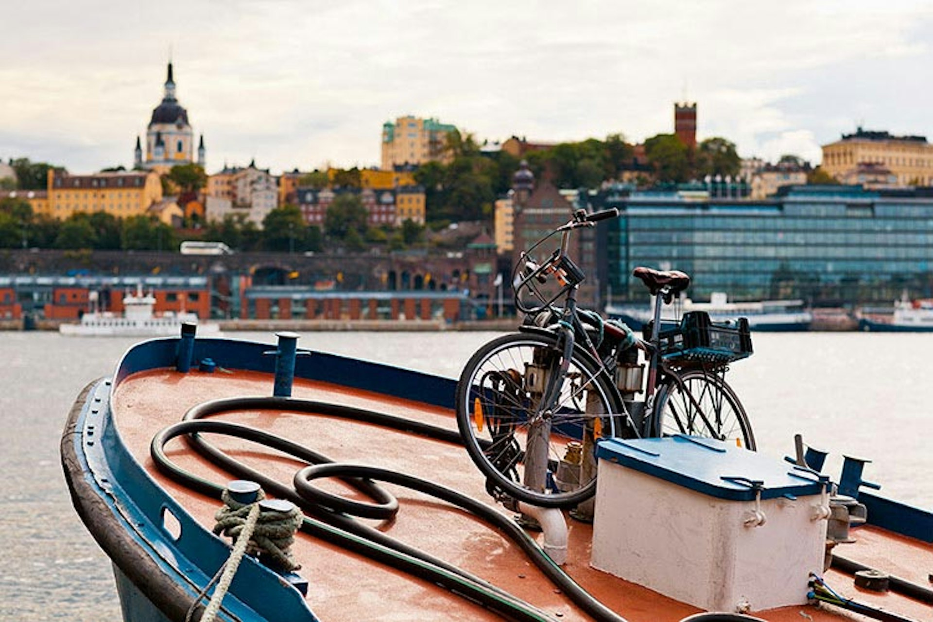 Don't be fooled by this placid waterside view in Södermalm, Stockholm - a literary walking tour can help you to the city's imaginary underbelly. Image by Merten Snijders / Getty Images