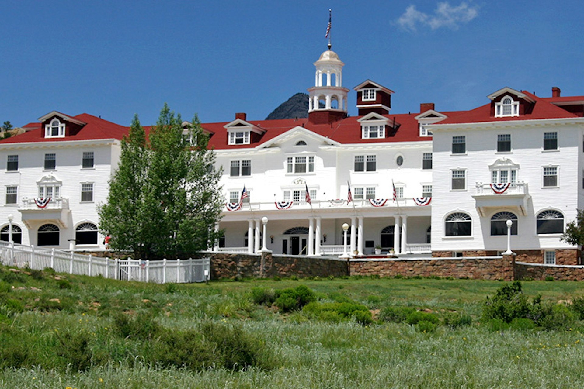 The Stanley Hotel may not look eerie, but the hotel staff say it's haunted. Image by Frank Kovalchek / CC BY 2.0