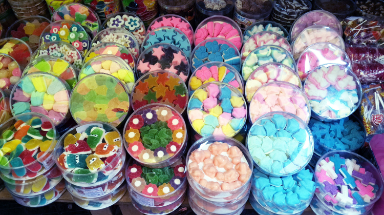 Mountains of candy for sale at La Merced. Image by Katja Gaskell / Lonely Planet