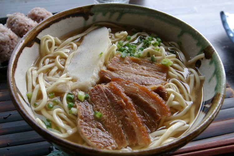 Okinawan soba topped with pork slices