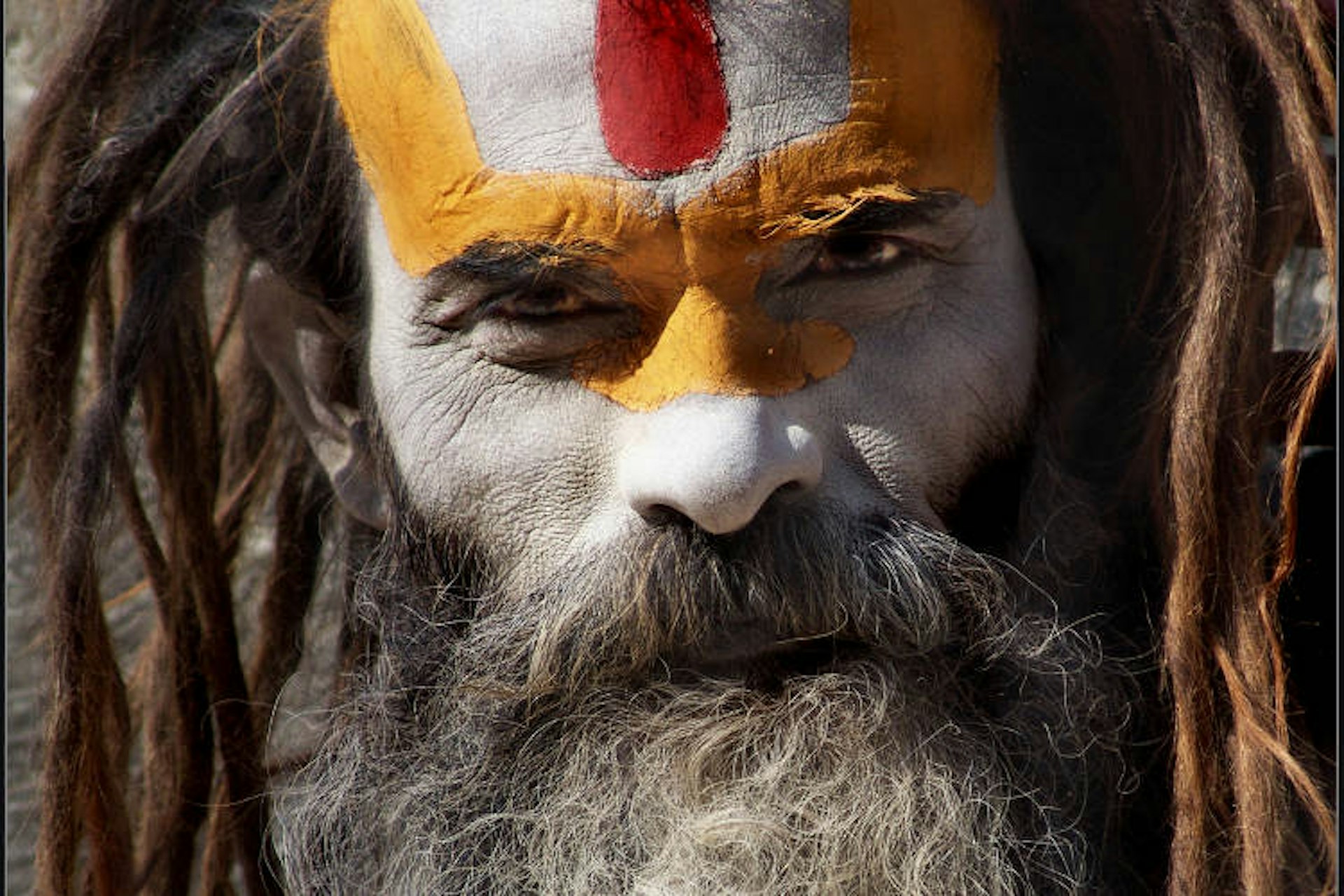 Sadhu in ceremonial face-paint at Pashupatinath. Image by Sukanto Debnath / CC BY-2.0.
