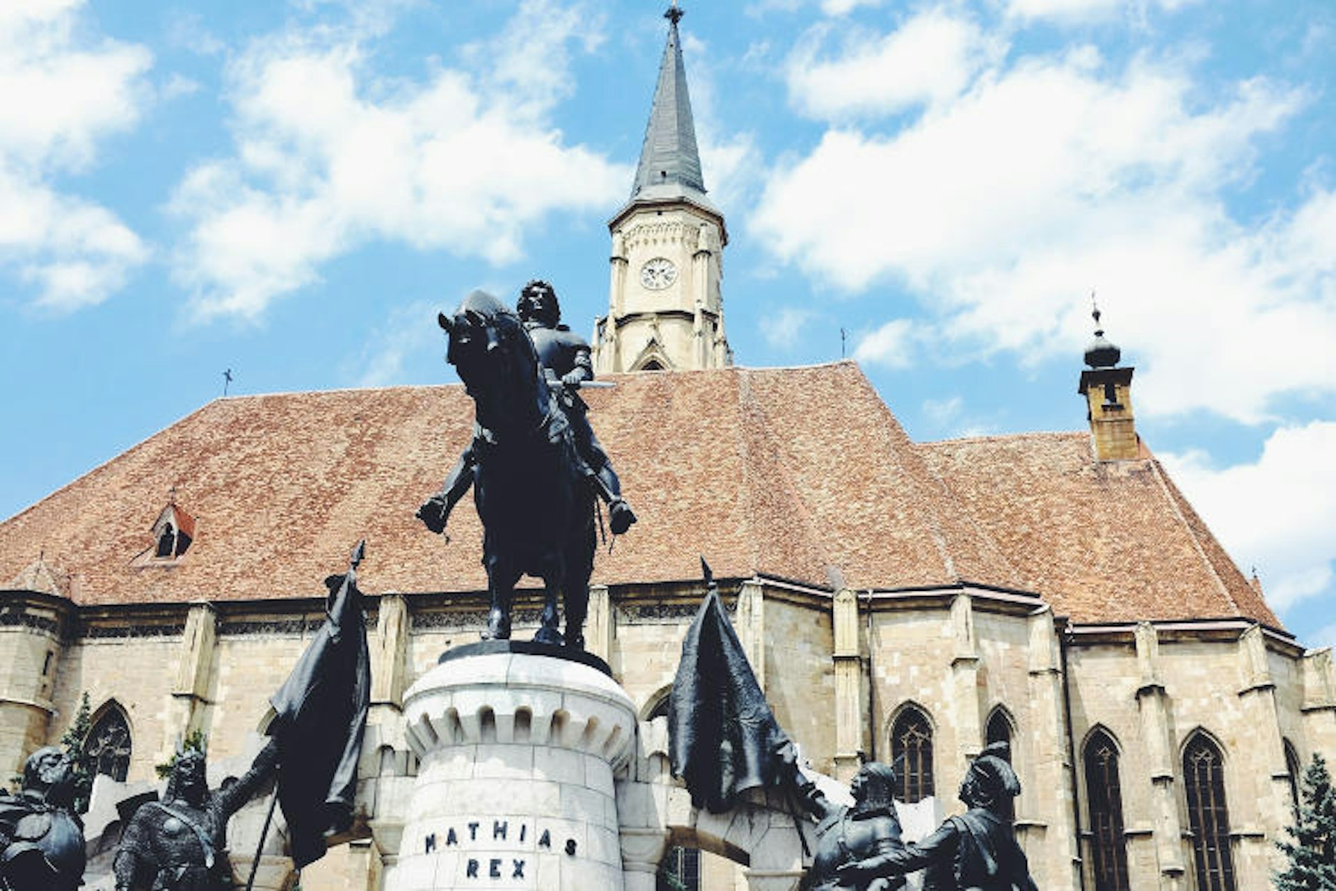 Matthias Corvinus statue flanks St Michael's church in Cluj-Napoca. Image by Mark Baker / Lonely Planet