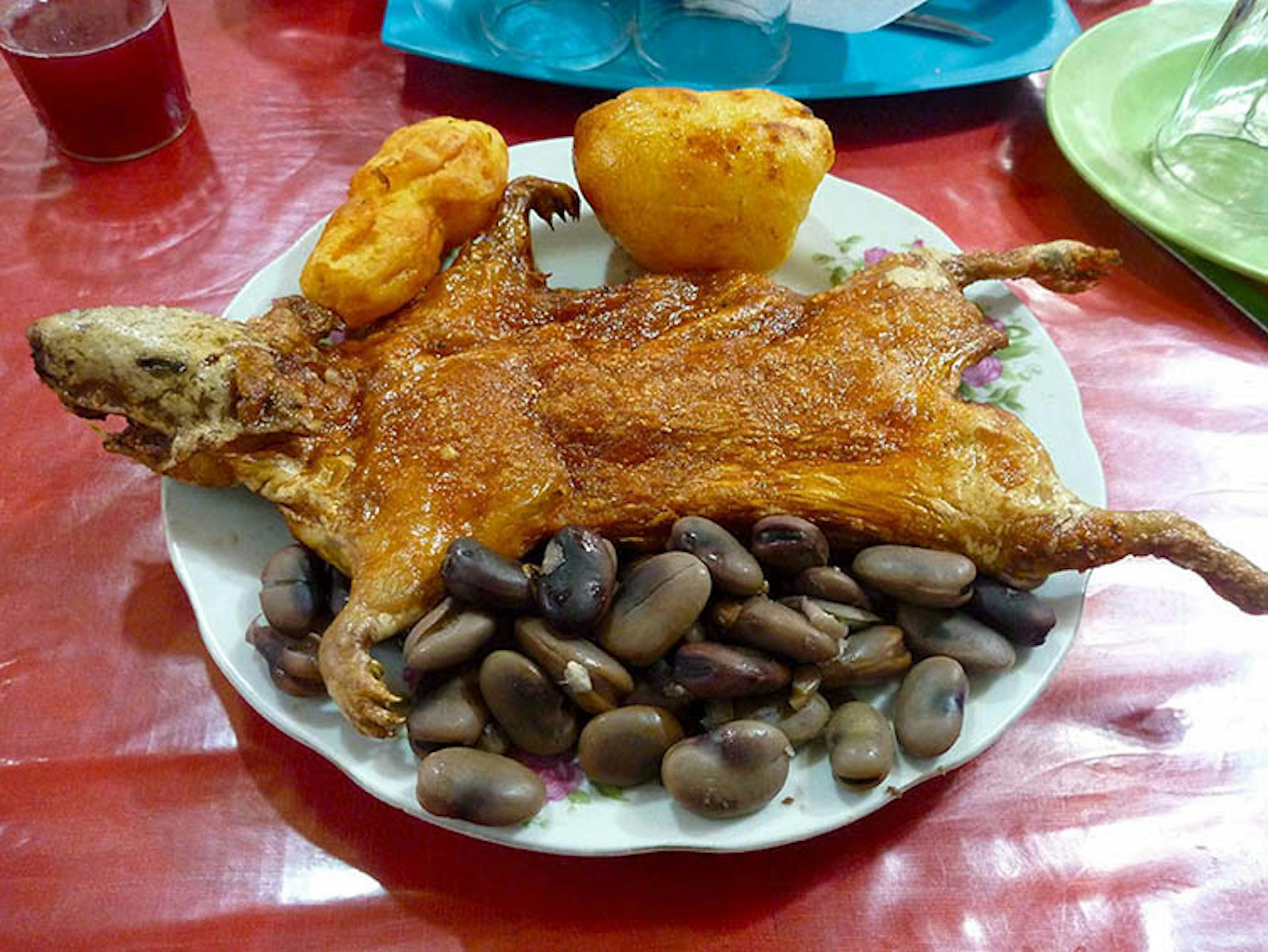 Not so cuddly now... a hearty plate of guinea pig, potatoes and beans in Peru. Image by Cute Kitten Images / Getty Images