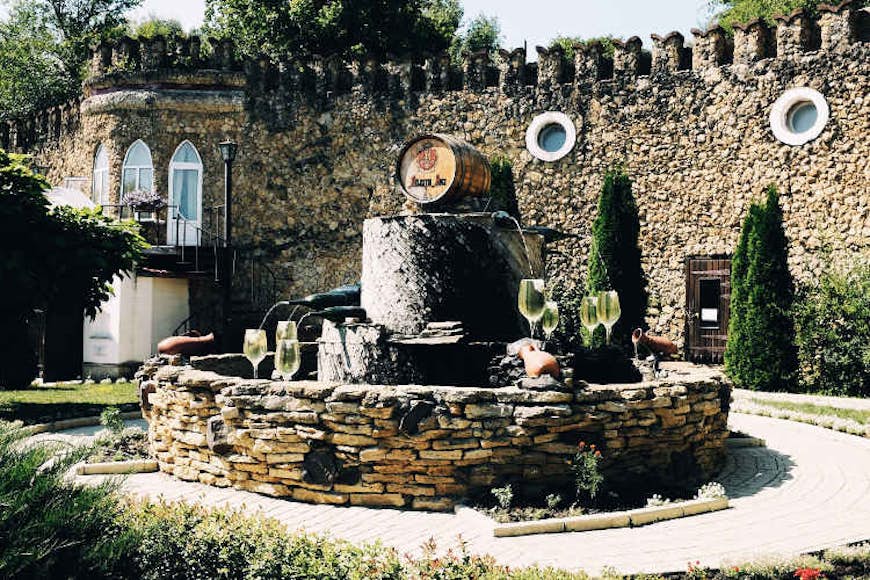 Statues and fountains greet visitors to the Mileştii Mici winery. Image by Mark Baker / Lonely Planet