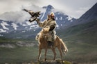 Shohan the hunter with his golden eagle in the Upper Dayan Valley of Mongolia. Image by David Baxendale / Lonely Planet