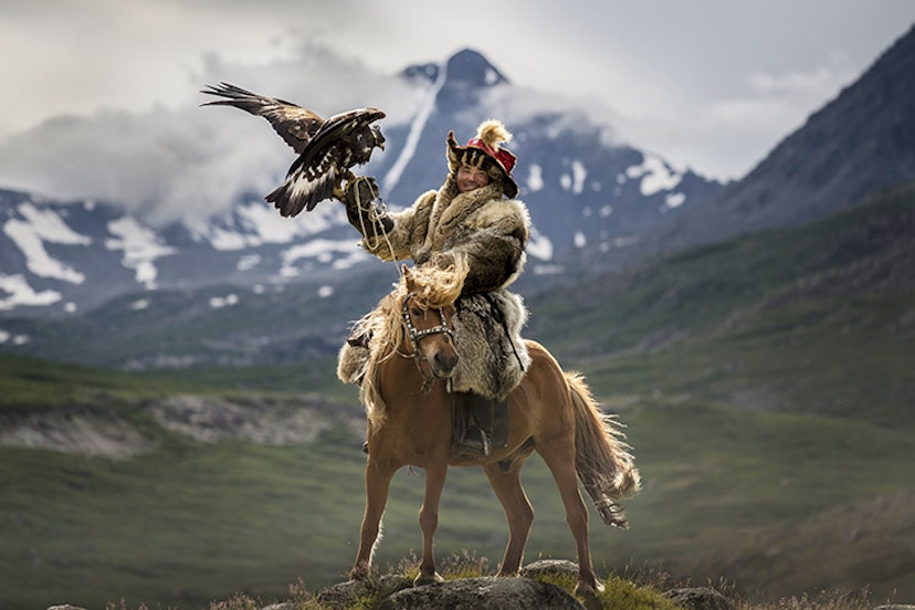 Shohan the hunter with his golden eagle in the Upper Dayan Valley of Mongolia. Image by David Baxendale / Lonely Planet