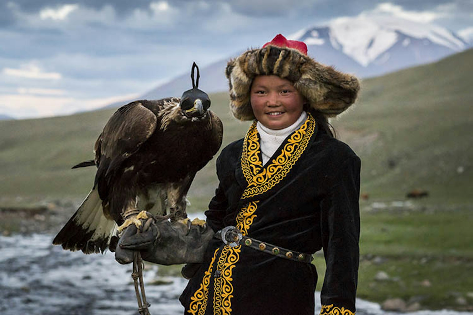 Female huntress Ashol-Pan with her father's eagle. Image by David Baxendale / Lonely Planet
