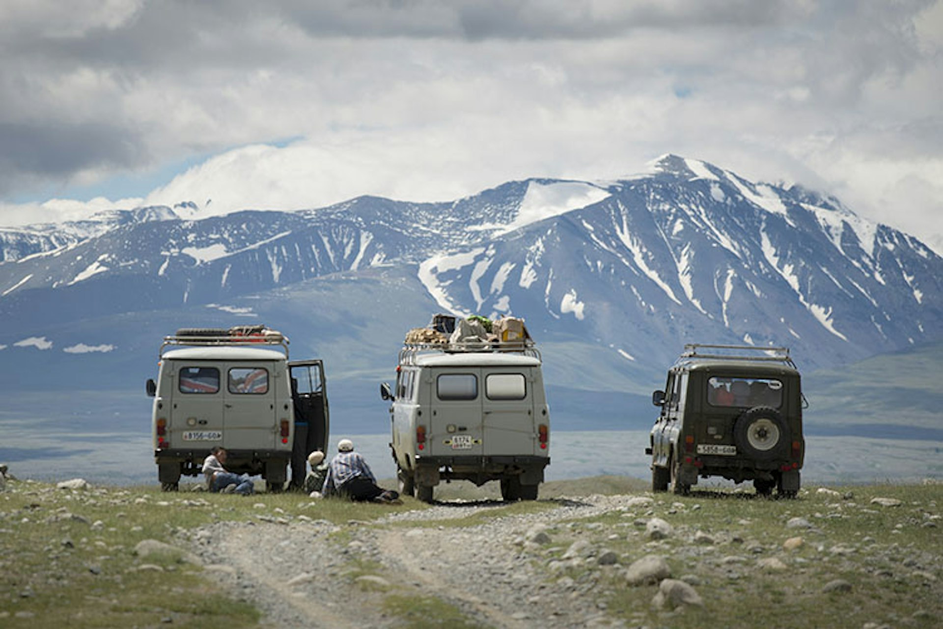 Ex-Russian military 4x4s traverse the rough Altai terrain. Image by David Baxendale / Lonely Planet