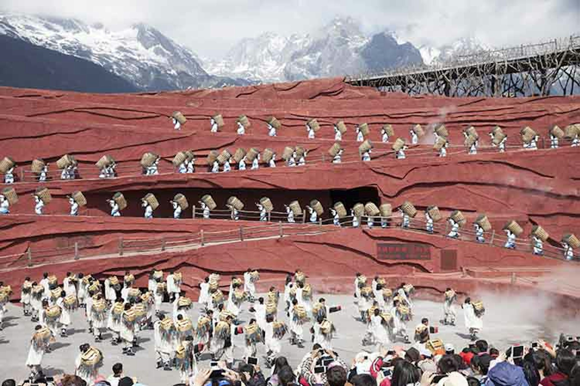 Performance at Jade Dragon Mountain in Lijiang. Image by Anna Willett / Lonely Planet