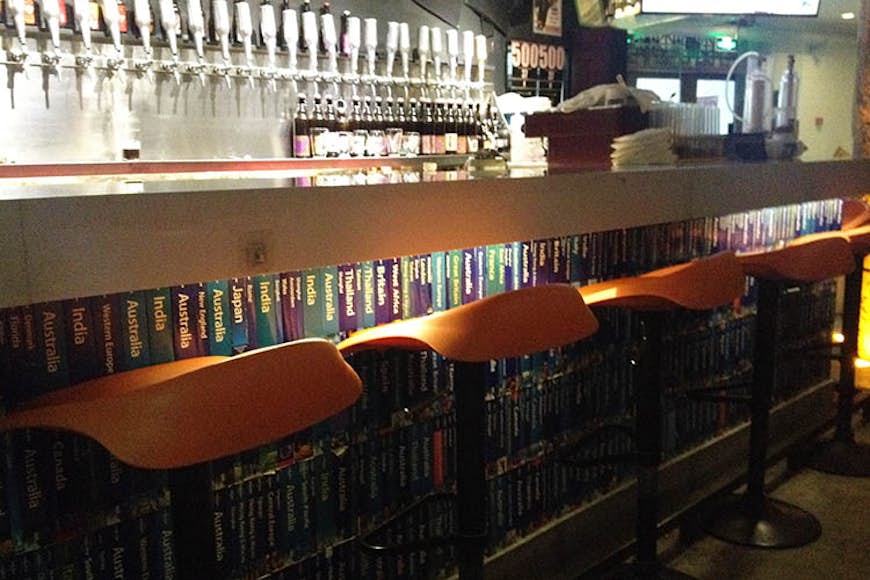 Taps and Lonely Planet books at Nbeer. Image by Megan Eaves / Lonely Planet