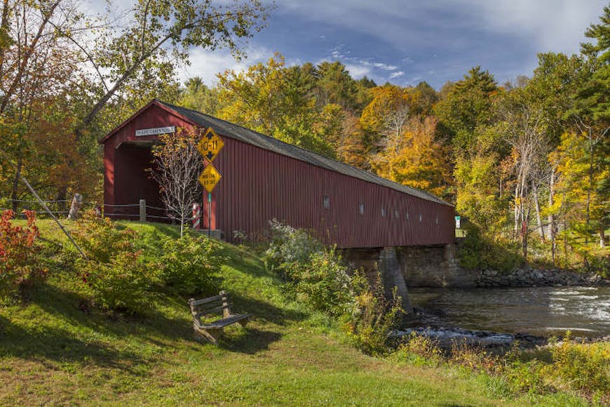 The picturesque covered bridge in West Cornwall, Connecticut. Image by Jeff Hunter / Photostock / Getty
