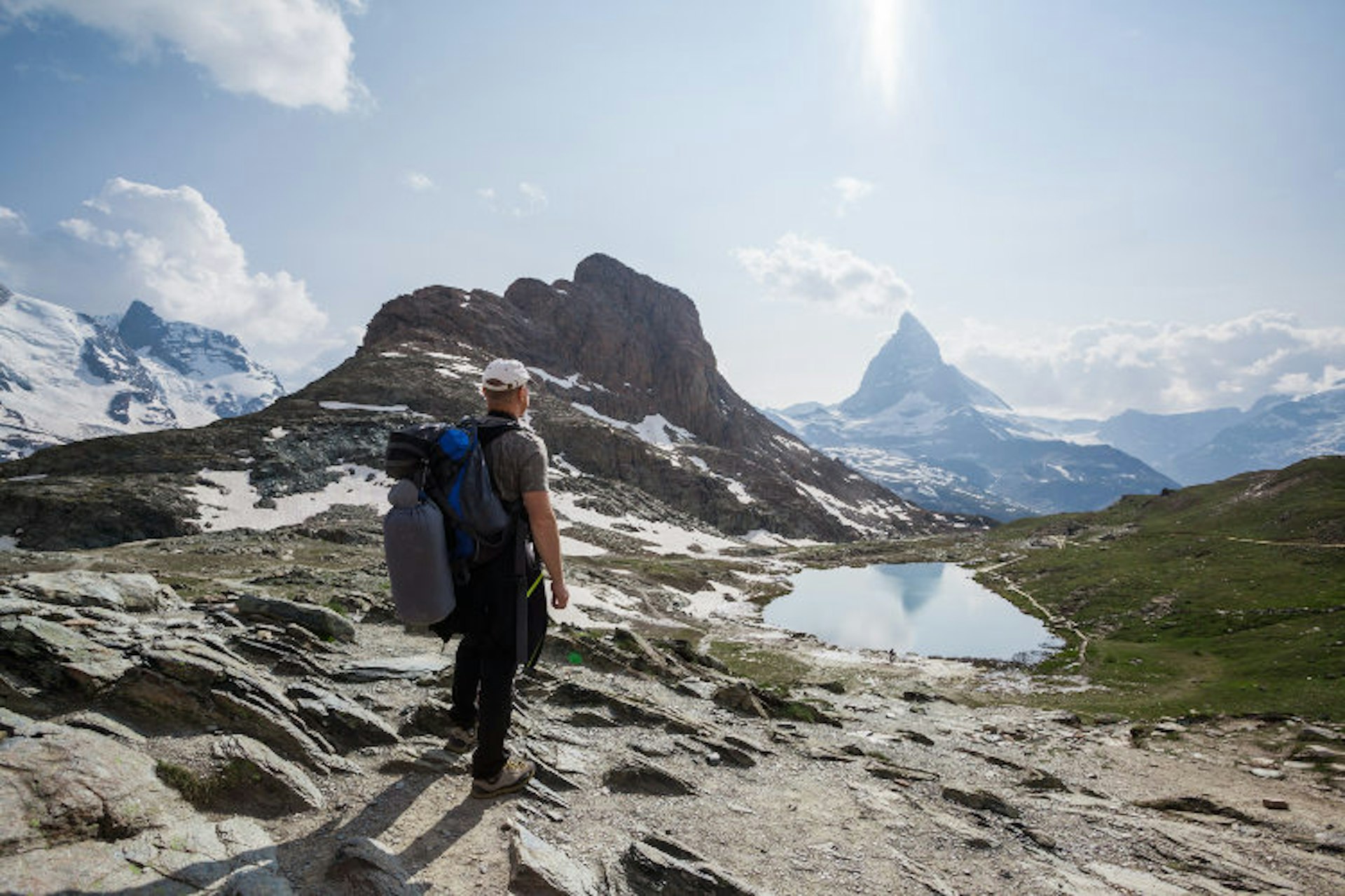 Hiker admiring the stunning Matterhorn view. Image by Matteo Colombo/Photostock/Getty