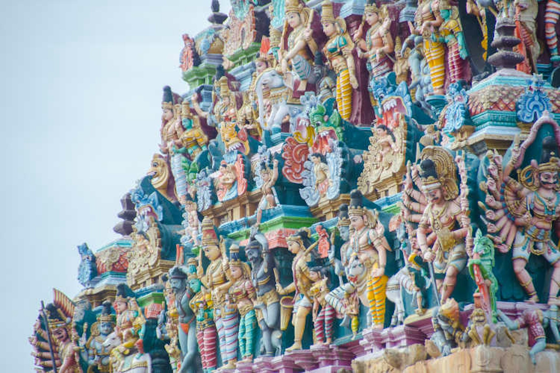 Sculpted deities in rainbow colours on the Meenakshi Amman Temple. Image by cotaro70s / CC BY-ND 2.0.