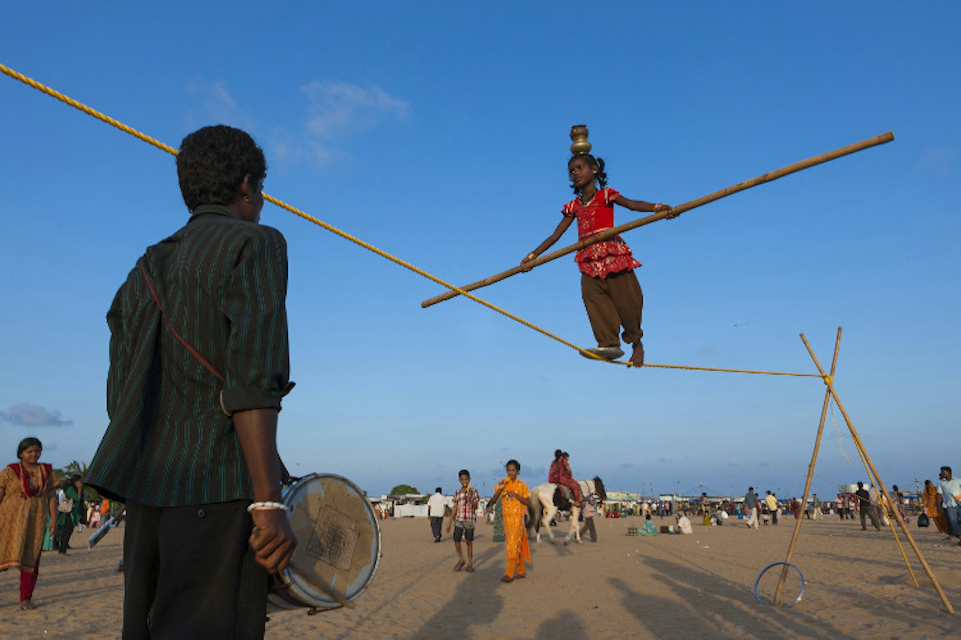 Acrobats at Marina Beach, Chennai. Image by Felix Hug / Getty Images. 