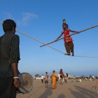 Acrobats at Marina Beach, Chennai. Image by Felix Hug / Getty Images.