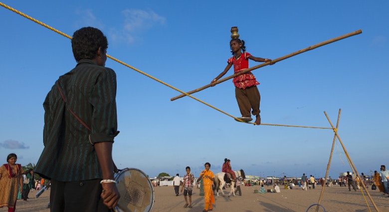 Acrobats at Marina Beach, Chennai. Image by Felix Hug / Getty Images.