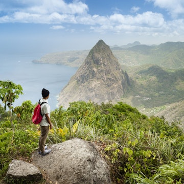 Features - Hiker standing at lookout towards Gros Piton.