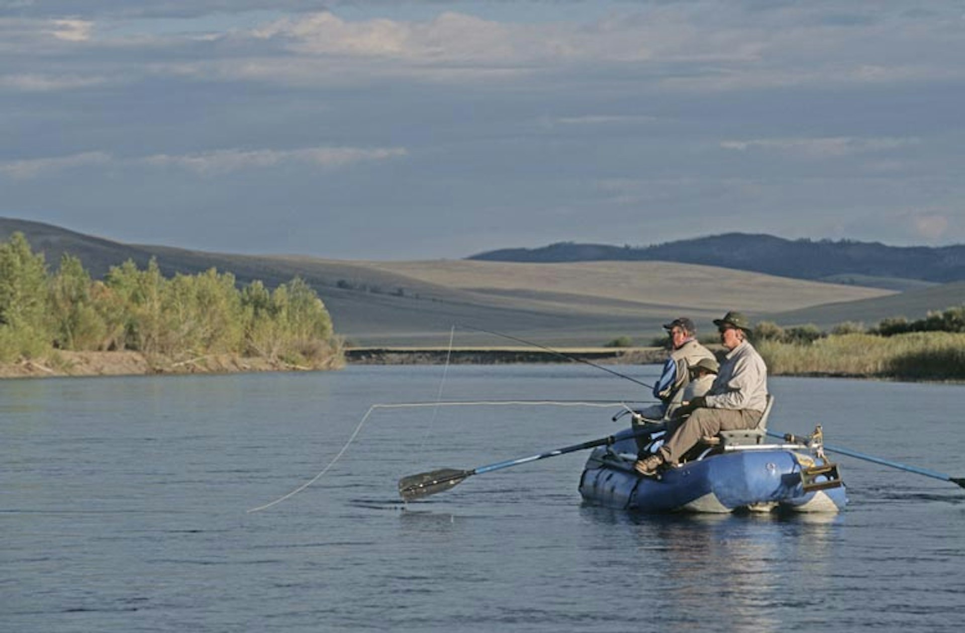 Looking for a tranquil spot to sling a hook? Try fly-fishing in remote Mongolia. Image by Dave Hamman / E+ / Getty Images