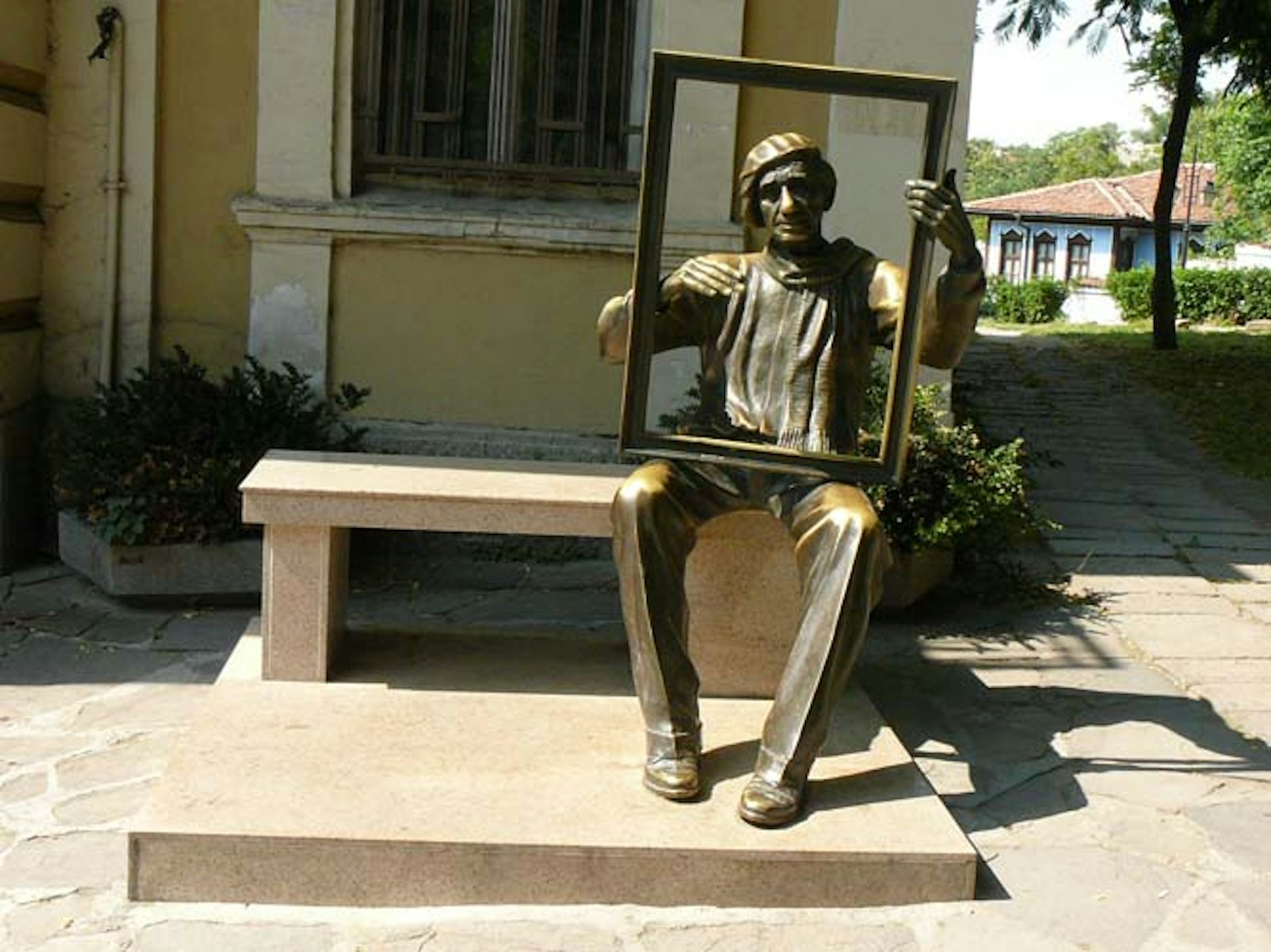 A cheeky artist statue in Plovdiv's Old Town. Image by Anita Isalska / Lonely Planet