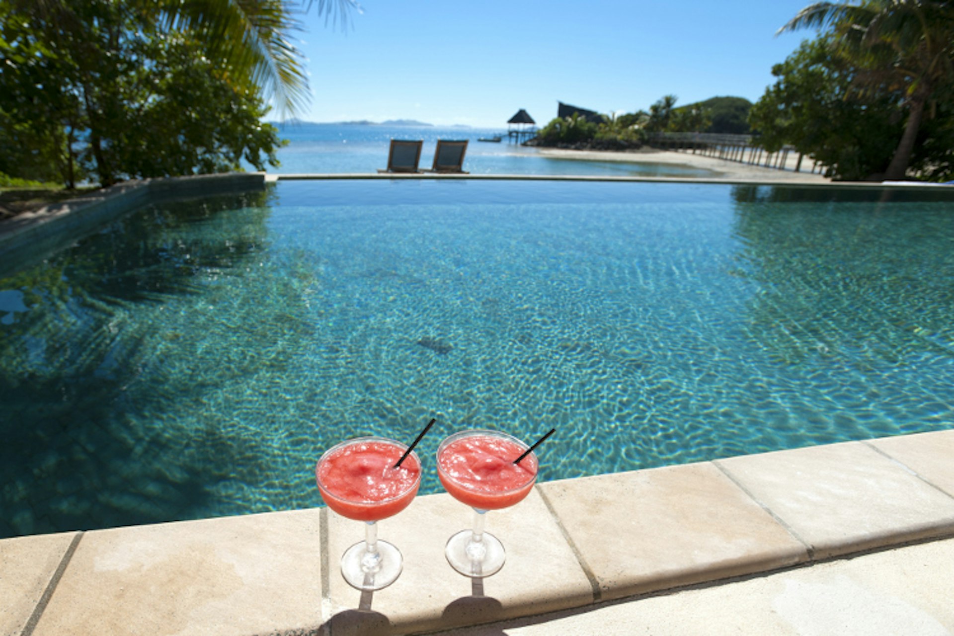Poolside cocktails for two. Image by Courtney Keating / Getty Images