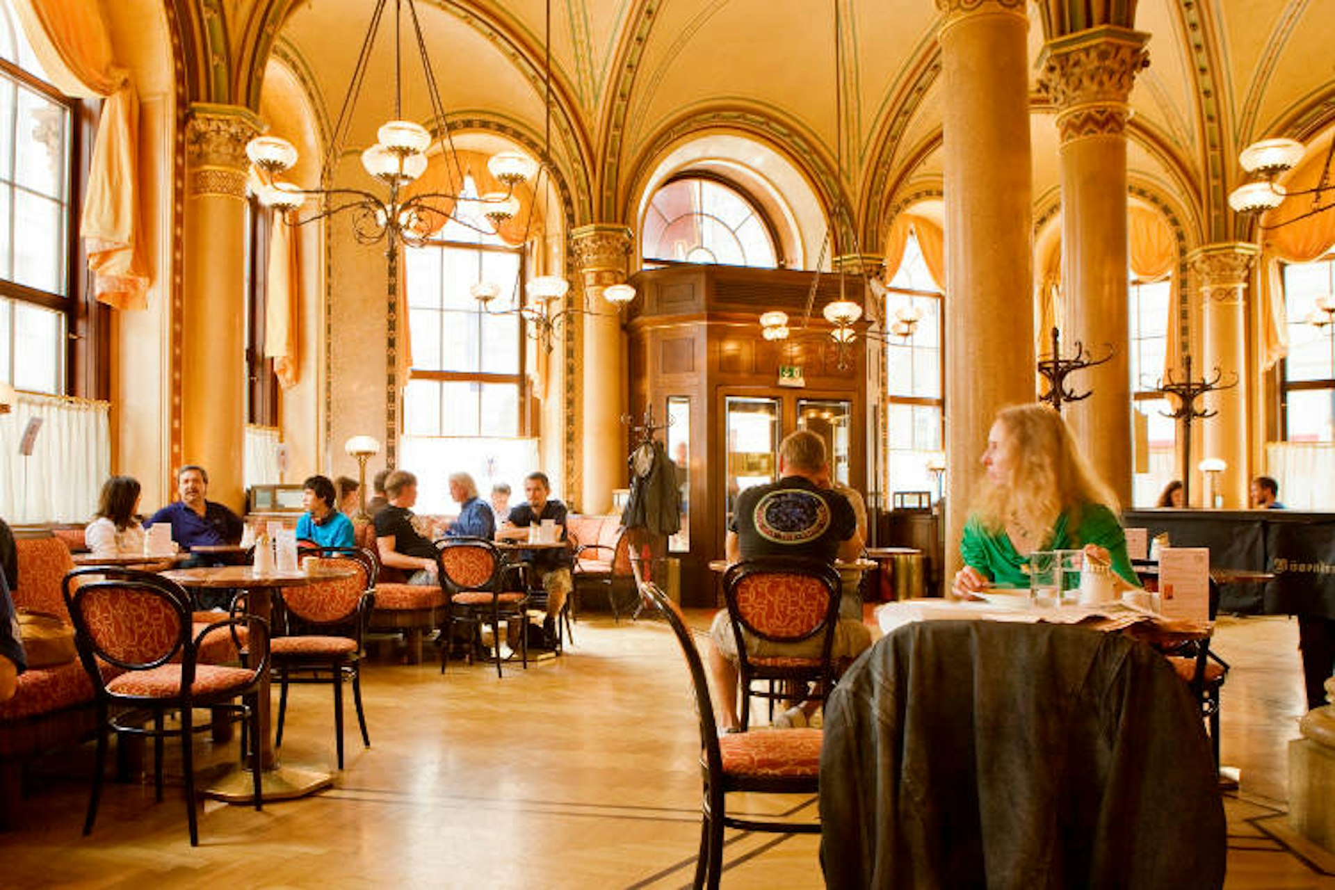 Enjoying the opulent surrounds at Café Central. Image by Jean-Pierre Lescourret/Photostock/Getty