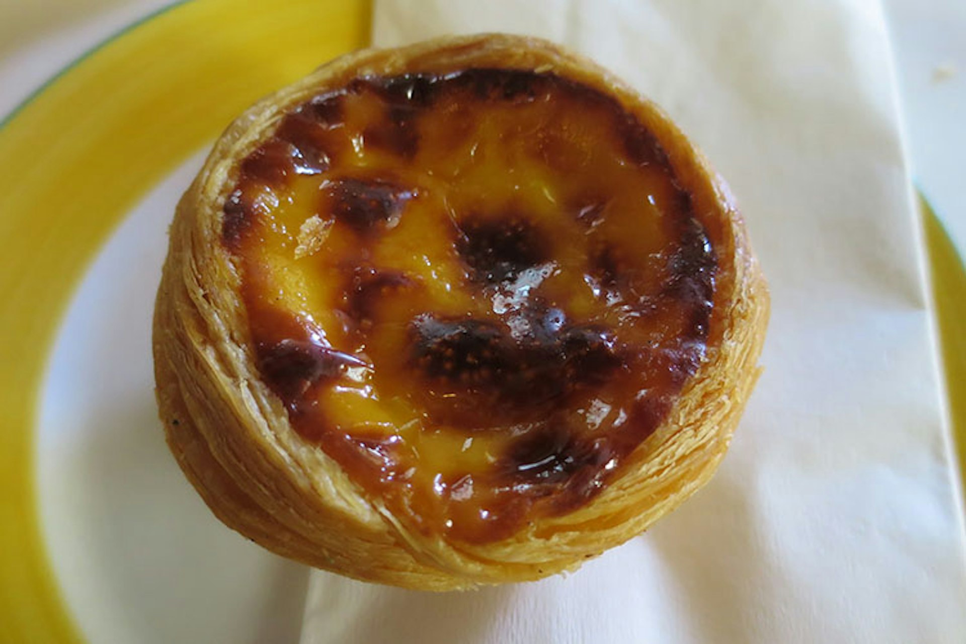 Macanese egg tart. Image by Megan Eaves / Lonely Planet