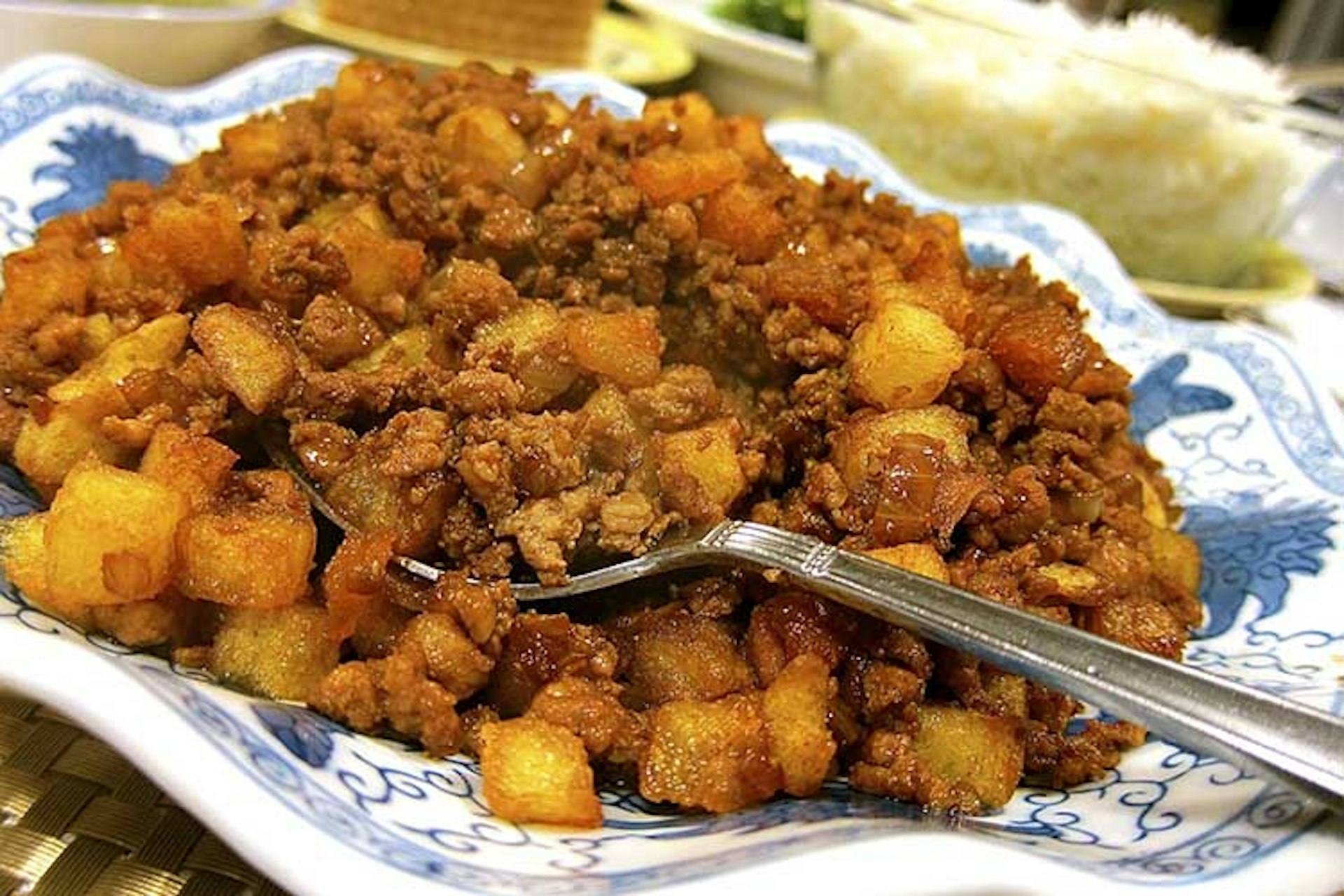 Minchi served over potatoes. Image courtesy of Macau Government Tourism Organisation