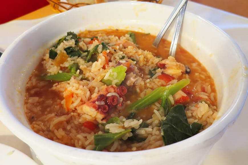 Seafood and rice stew. Image by Megan Eaves / Lonely Planet