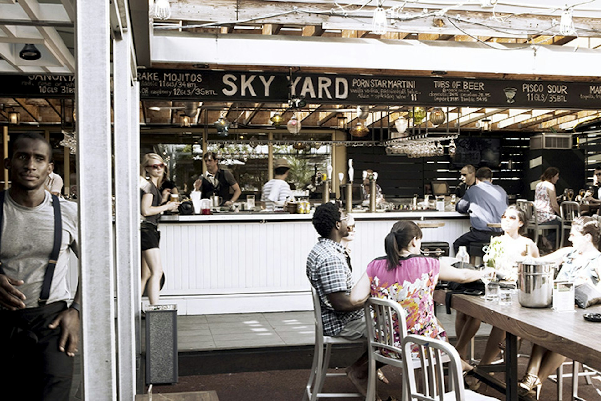 Sit down for a cocktail at the Sky Yard, the Drake Hotel's rooftop patio. Image courtesy of Drake Hotel Properties / Photo by Connie Tsang