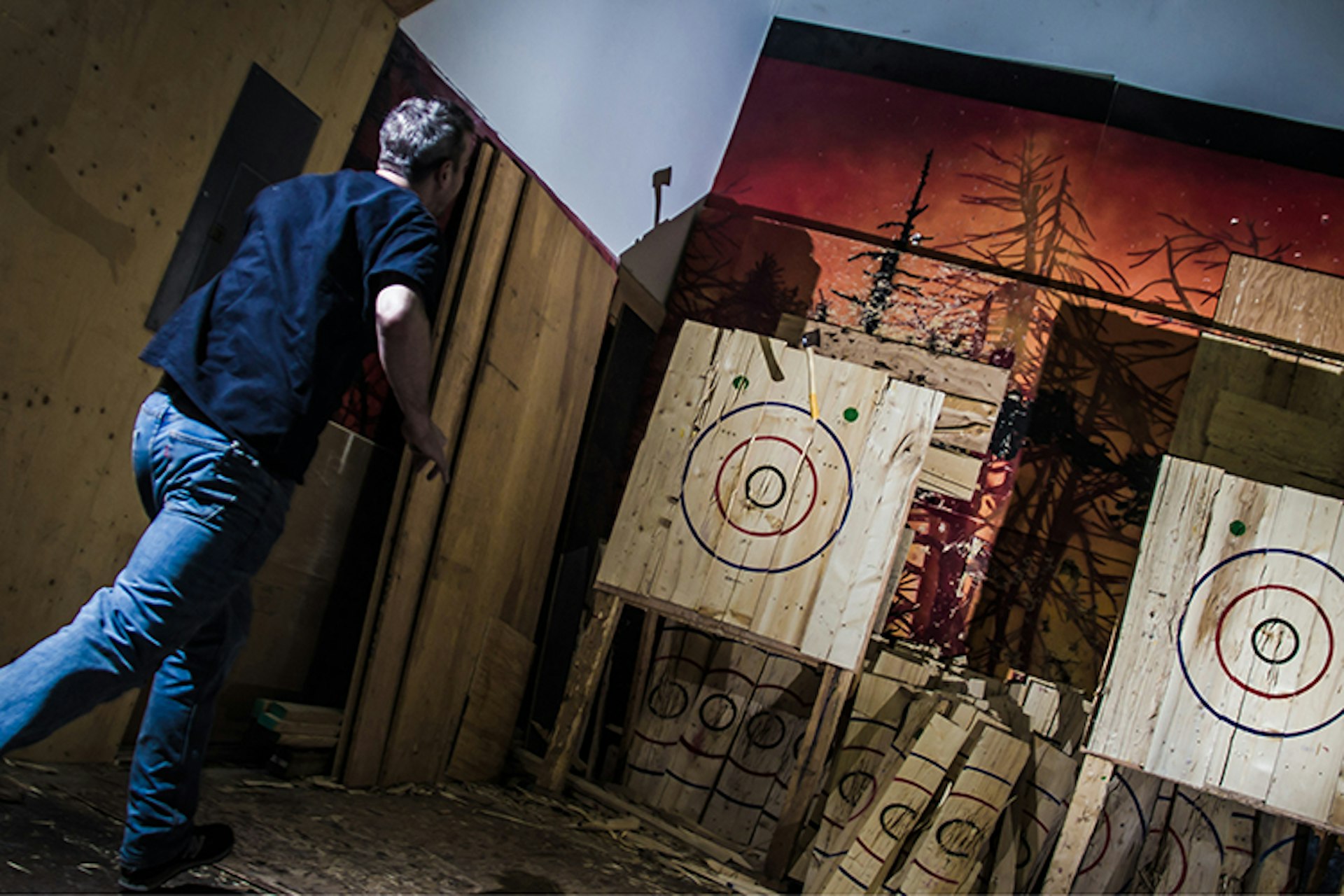 A thrower taking a shot at backyard axe throwing. Image courtesy of BATL