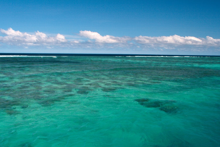The happy hues of a blue sky and turquoise sea. Image by Christian Haugen / CC BY 2.0