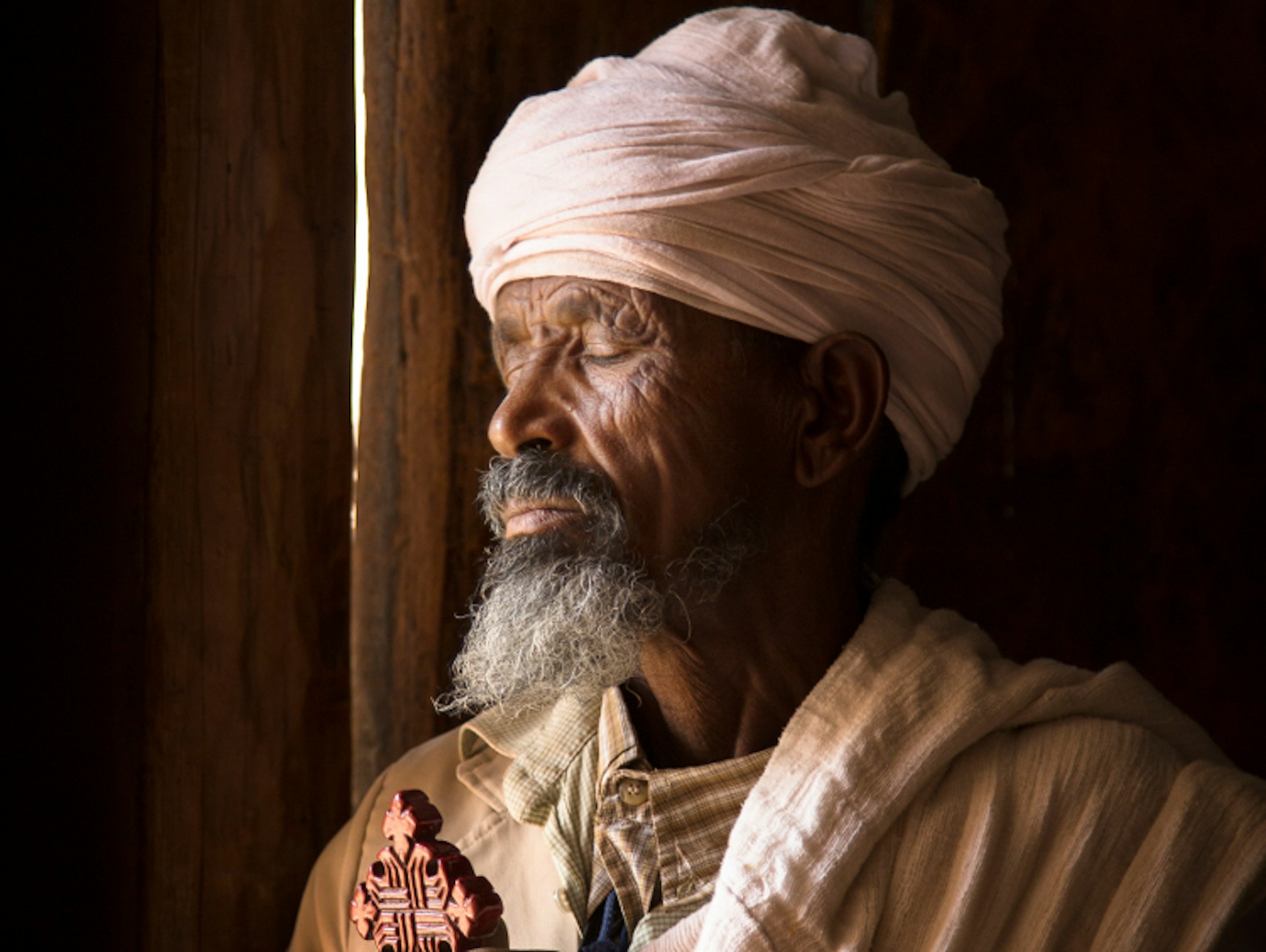 Keshi Teklai Abreha, the priest at the church of Abreha we Atsbeha. Image by Philip Lee Harvey / Lonely Planet