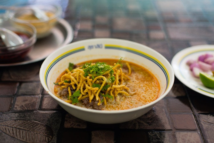 A bowl of kow soy, wheat noodles in a curry broth, Chiang Mai. Image by Austin Bush